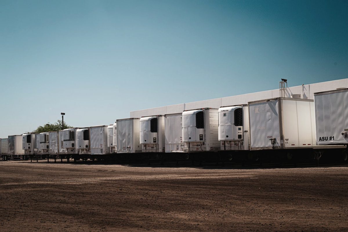 Row of dry van trailers staged for loading