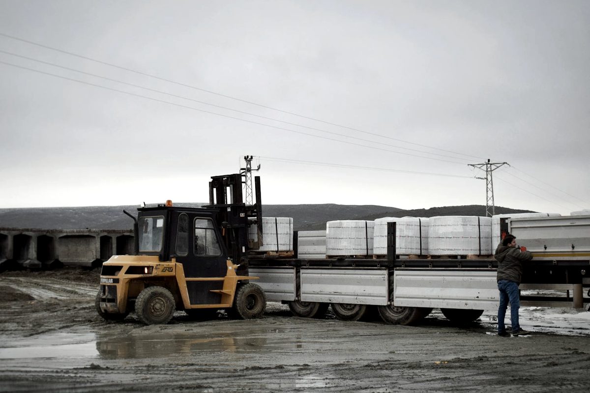 Flatbed and step deck trailer loaded with palletized cargo