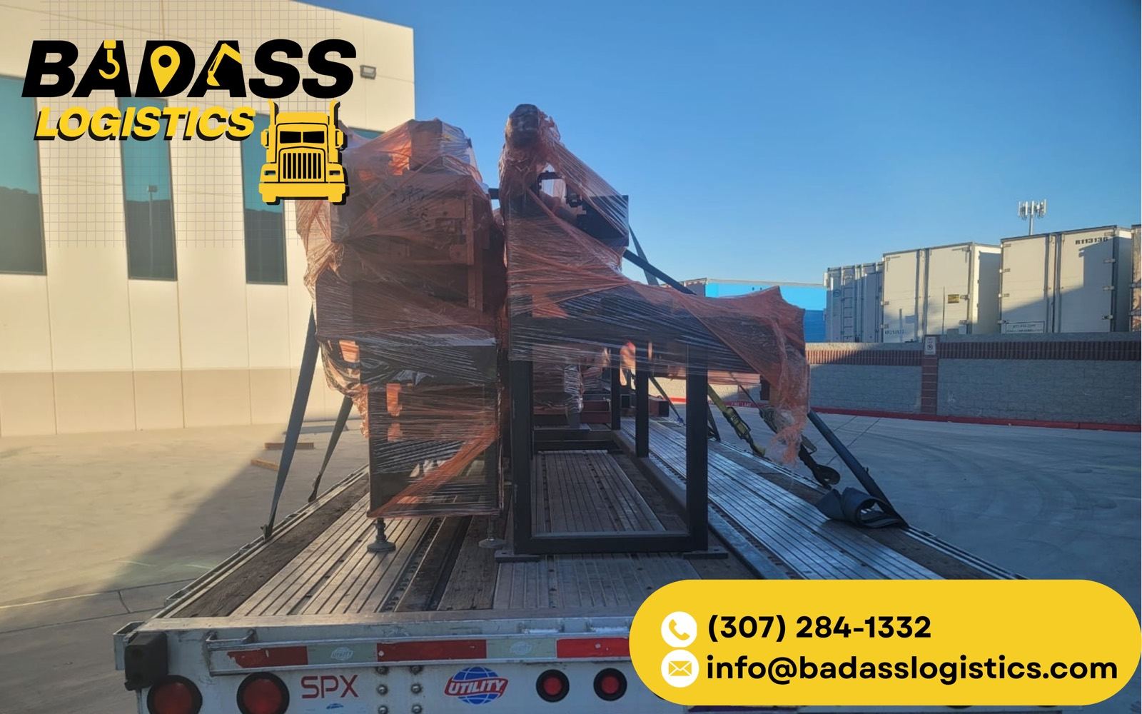 Shrink-wrapped steel structure secured on a Badass Logistics flatbed