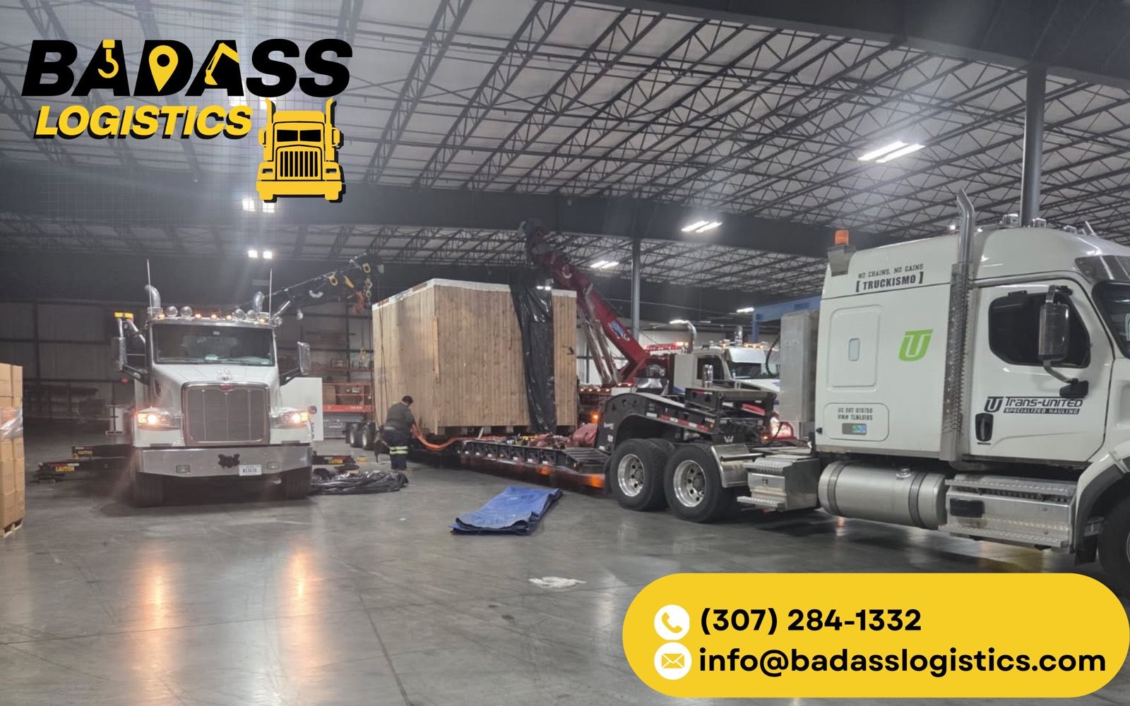 Crated industrial machine loaded onto a lowboy by the Badass Logistics crew