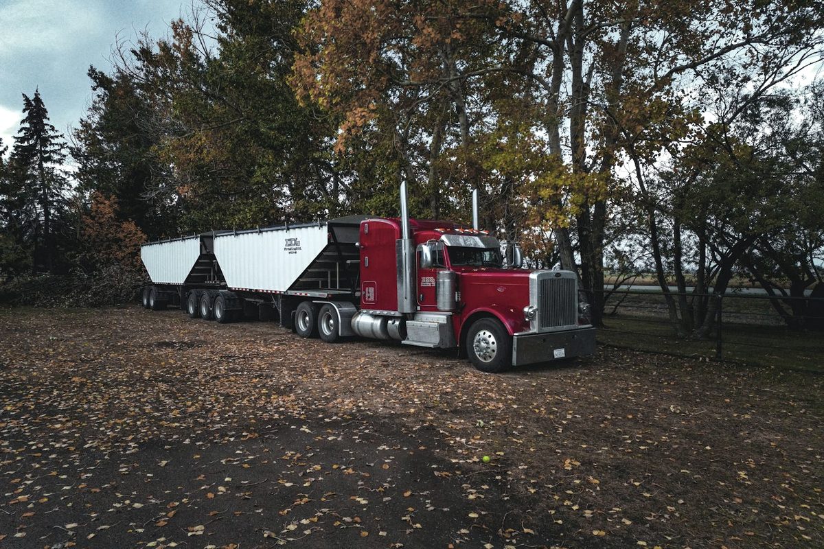 Machine loaded onto a heavy haul truck for door-to-door transport